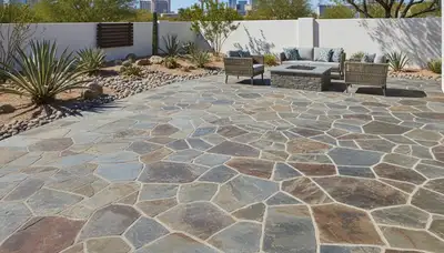 Natural flagstone patio installation by professional stone pavers in Las Vegas, NV landscaping