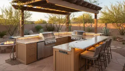 Desert-style outdoor kitchen with pergola and stone countertops by landscaping experts in Willow Beach, AZ
